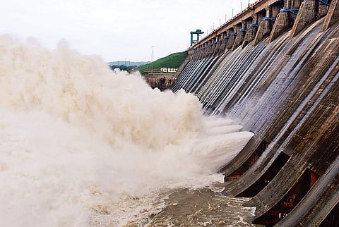Water being released from sluice gates of Hirakud dam reservoir on Tuesday I Express