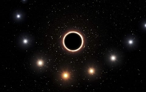 This artist's impression provided by the European Southern Observatory in July 2018 shows the path of the star S2 as it passes close to the supermassive black hole at the center of the Milky Way galaxy. As the star gets nearer to the black hole, a very st