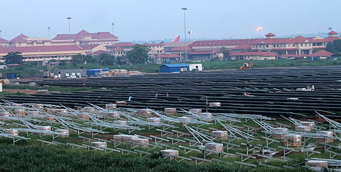 Solar panels set up on the premises of Cochin International Airport, Nedumbassery, as part of a solar-powered airport project being implemented at the facility. ( Express Photo service  |  Kaviyoor Santhosh)