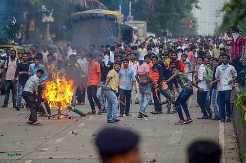 Maratha Kranti Morcha protesters pelt stones at police personnel during their statewide bandh called for reservations in jobs and education in Navi Mumbai on Wednesday July 25 2018. | PTI