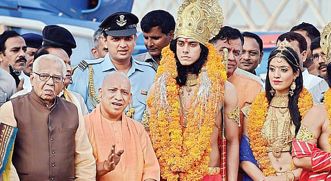 UP Governor Ram Naik and Chief Minister Yogi Adityanath with artistes dressed up as Lord Ram and Sita in Ayodhya on Wednesday (Photo| PTI)