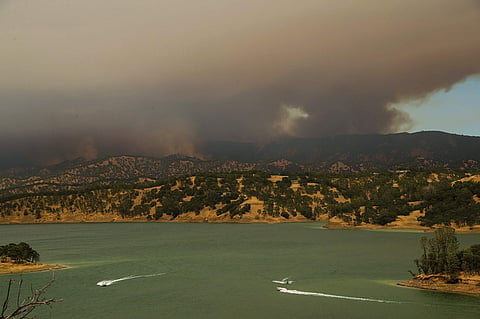 A massive wildfire in rural Northern California has exploded in size and forced evacuations in hot, dry weather that is sweeping through several western states where blazes are threatening thousands of homes. (Photo | AP)