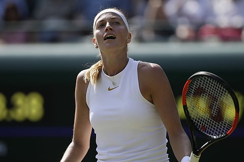 Petra Kvitova loses a point to Aliaksandra Sasnovich  during their women's singles match on the second day at the Wimbledon Tennis Championships in London. | AP