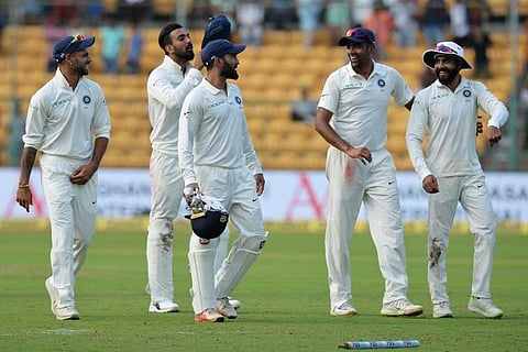 Indian cricketers walk back after their victory on the second day of one-off India Vs Afghanistan Test match at The M. Chinnaswamy Stadium in Bangalore on June 15, 2018.  | (File | AFP)