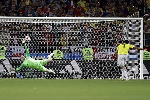 England goalkeeper Jordan Pickford saves a penalty during the round of 16 match between Colombia and England at the 2018 soccer World Cup in the Spartak Stadium, in Moscow, Russia, Tuesday, July 3, 2018. | AP