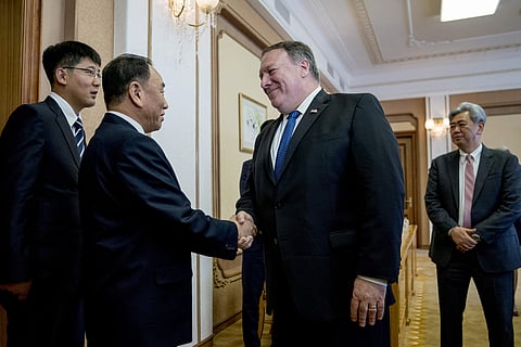 U.S. Secretary of State Mike Pompeo, second from right, greets Kim Yong Chol, second from left, a North Korean senior ruling party official and former intelligence chief, as they arrive for a meeting at the Park Hwa Guest House in Pyongyang, North Korea, 