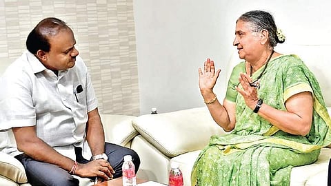 Chairperson of Infosys Foundation Sudha Murthy with Chief Minister  H D Kumaraswamy  at the latter’s home office Krishna, on Saturday