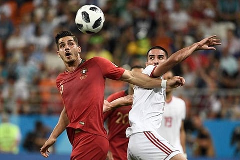 Portugal's forward Andre Silva (L) and Iran's defender Milad Mohammadi vie for the ball during the Russia 2018 World Cup Group B football match between Iran and Portugal at the Mordovia Arena in Saransk on June 25, 2018.  | (File | AFP)