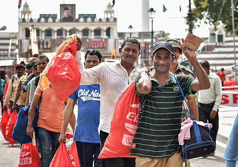Attari Indian prisoners at Pakistan cross Wagah border as they return after their release ahead of Independence Day in Attari on Monday Aug 13 2018. Pakistan sent back 29 prisoners including Gajanand who is being released after completing his sentence of 