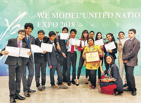 Students of Inventure Academy pose with their certificates at the  WE Model United Nations (WEMUN) Expo 2018