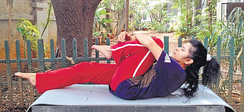 Fold your knees to relieve bloating
