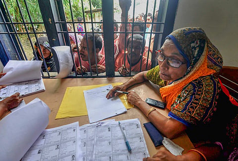 People wait in a queue to check their names on the final draft of the state's National Register of Citizens after it was released at an NRC Seva Kendra in Assam. (File | PTI)