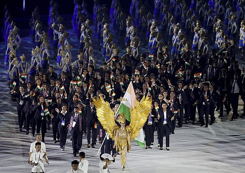 The Indian team marches in during the opening ceremony of the 18th Asian Games at Gelora Bung Karno Stadium in Jakarta, Indonesia. (Photo | AP)