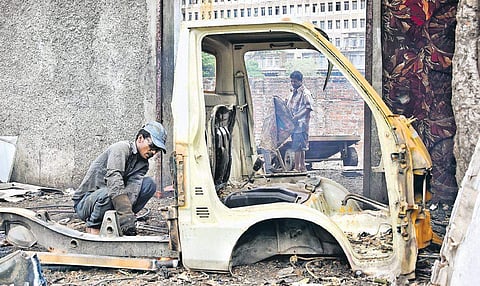 A shopkeeper prepares to vacate his shop following eviction notice from officials  |  ASHWIN PRASATH