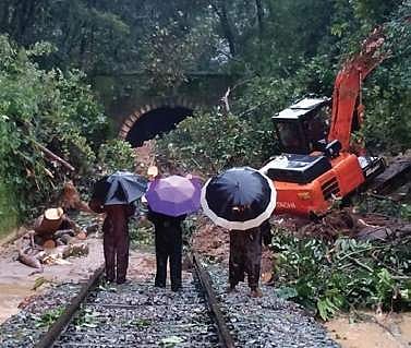 Railway personnel and contract workers clearing tracks in the Subrahmanya  Road-Sakleshpur Ghat stretch
