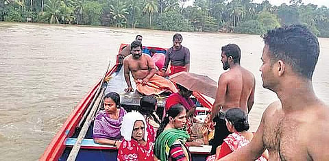 Fishermen from Pookottu Araya Samajam Karayogam in Alappad rescuing stranded people in flood-hit Chengannur on Sunday