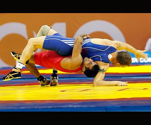 India's Sunil Kumar fights with Australia's Cory O'Brien in their 66kg Greco-Roman wrestling bout during the Commonwealth Games 2012. (File Photo)