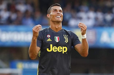 Juventus' Cristiano Ronaldo runs with the ball during the Serie A soccer match between Chievo Verona and Juventus, at the Bentegodi Stadium in Verona, Italy. (Photo | AP)