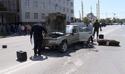 In this video grab provided by the RU-RTR Russian television, Investigators inspect a car that was allegedly used to attack police in the regional capital, Grozny, Russia. (Photo | AP)