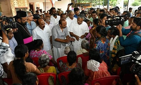 CM Vijayan interacting with inmates of a relief camp set up at Gregorios School, North Paravoor in Ernakulam district.  (Photo | Twitter)