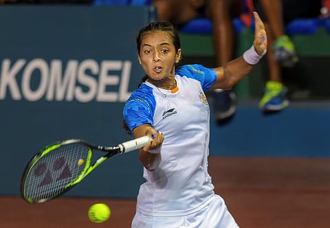 Indian tennis player Ankita Raina returns to Korean duo of Na RJ Kim and Jeamoon Lee in the mix-doubles tennis match at the 18th Asian Games 2018 at Palembang in Indonesia. (Photo | PTI)