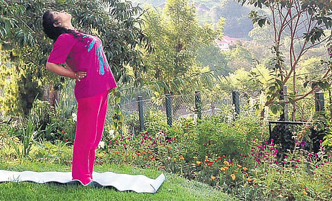 Practice Ardhachakrasan for a good posture 