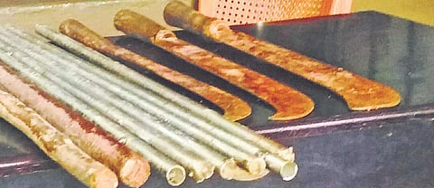 The swords and  the iron and wooden rods which the police recovered | express