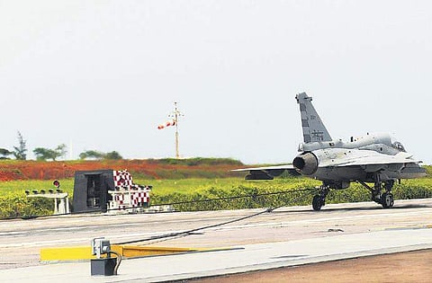 The Light Combat Aircraft (Naval prototype) completes a deck landing using the indigenously developed arrestor hook system, at INS Hansa, Goa, on Thursday