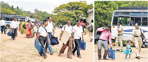 Polling officials carry electronic voting machines on the eve of local body elections in Mysuru on Thursday | Express