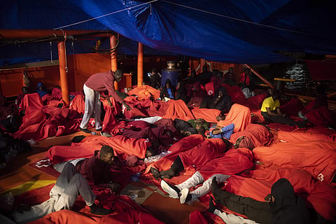 In this Monday, July 30 , 2018 photo, migrants rest inside a rescue vessel at the port of Algeciras, southern Spain, after being rescued by Spain's Maritime Rescue Service in the Strait of Gibraltar. (Photo | AP)