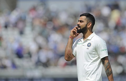 Indian cricket captain Virat Kohli walks in the field after his team lost the first test cricket match against England at Edgbaston | AP