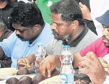 Shanthappa having ragi ball during the competition in Bengaluru on Saturday