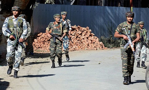 Army personnel move towards the house where militants were holed up at Ladoora village in Rafiabad area of Baramulla district on August 2. (File | PTI)