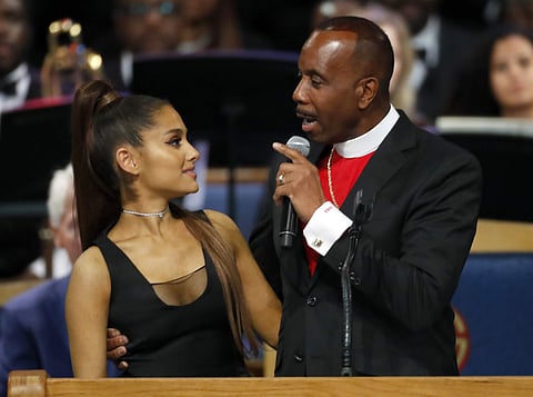 Images of the moment showed Ellis' hand holding Grande well above her waist, with his fingers pressing against one side of her chest. (Photo | AP)
