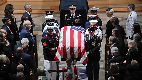 John McCain's casket is carried during the recessional at the end of the memorial service. (Photo | AP)