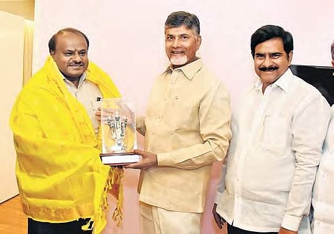 Chief Minister N Chandrababu Naidu felicitating his Karnataka counterpart  HD Kumaraswamy in Vijayawada on Friday I Express
