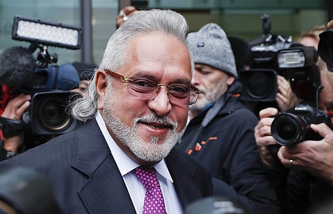 F1 Force India team boss Vijay Mallya smiles as he arrives to attend a hearing at Westminster Magistrates Court in London, Wednesday. (Photo | AP)
