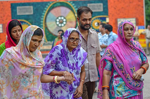 Relatives mourn during cremation of the 11 members of a family who were found hanging in their house in Burari at Nigambodh Ghat in New Delhi. (Photo | File/PTI)