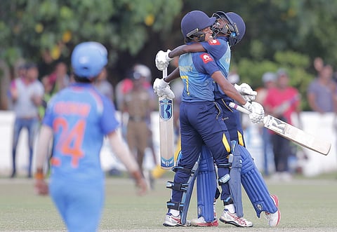 Sri Lanka's Kavisha Dilhari, right, and Sripali Weerakkody celebrate their victory over India by three wickets in the third women's ODI match in Katunayake, Sri Lanka, Sunday, Sept. 16, 2018. | AP