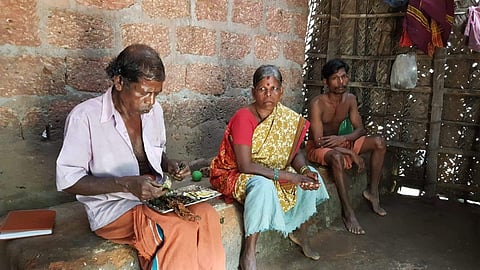 Mankukutty T, wife Sundari and son Suresh T in Thottathumoola colony in Bellur panchayat. (Photo | ENS)