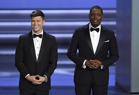 Hosts Colin Jost, left, and Michael Che speak at the 70th Primetime Emmy Awards on Monday, Sept. 17, 2018, at the Microsoft Theater in Los Angeles. (Photo: AP)