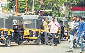 Autorickshaw drivers wait for passengers at  an auto stand  Vincent Pulickal