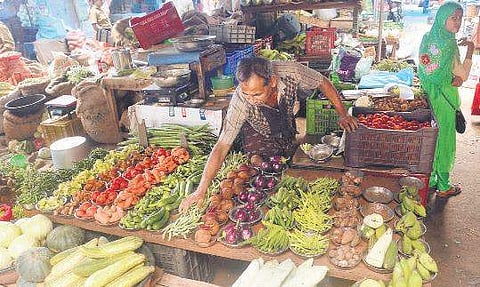 A vegetable vendor at his stall at Chalai Market Vincent Pulickal
