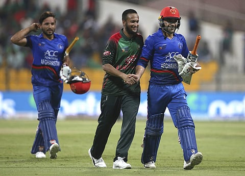 Bangladesh's Shakib Al Hasan congratulates Afghanistan's Rashid Khan (R) besides Gulbadin Naib at the end of the innings | AP