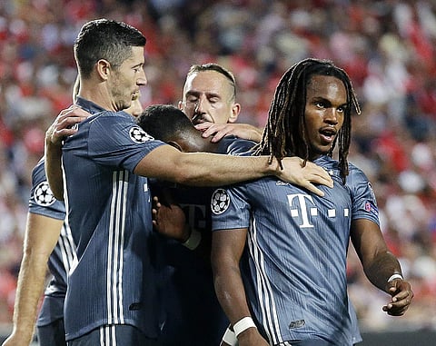 Bayern midfielder Renato Sanches, right, and Bayern forward Robert Lewandowski, left, celebrate their side's second goal during the Champions League group E soccer match between Benfica and Bayern Munich at the Luz stadium in Lisbon, Wednesday, Sept. 19, 