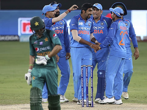 India's Jasprit Bumrah celebrates with teammates the dismissal of Pakistan's Shoaib Malik during the Asia Cup clash | AP