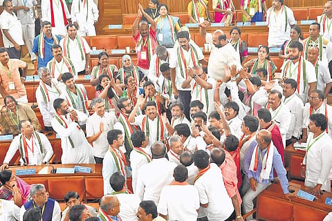 Complete pandemonium prevails as Congress and BJP councillors argue with each other during the mayoral election  on Friday | Express