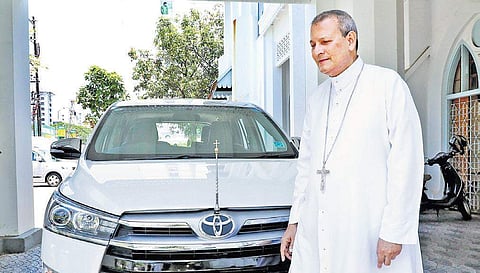 Verapoly Archbishop Joseph Kalathiparambil with his Innova Crysta which he decided to sell and contribute its proceeds to CMDRF | Melton Antony