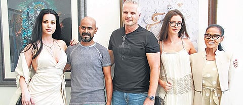 L Ramachandran (second from left) has featured 20 Indian models in his work