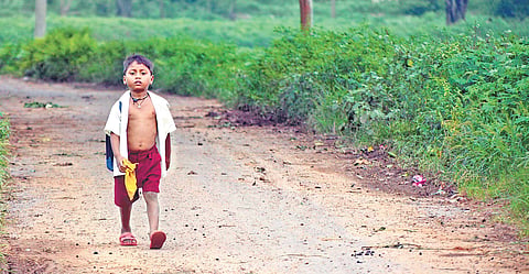Suraj Minz has to walk nearly two km every day to reach school ever since the school he was studying in was merged with another.